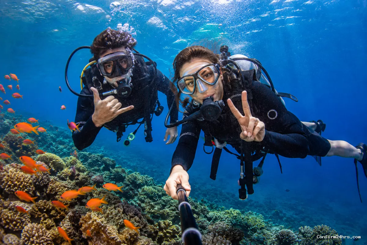 Scuba diving in Andaman with coral reef and colorful fish